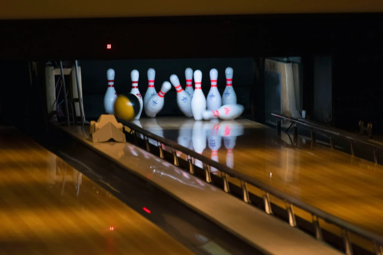 Lace up those rental shoes — a fun, competitive, and lighthearted activity that encourages real interaction.