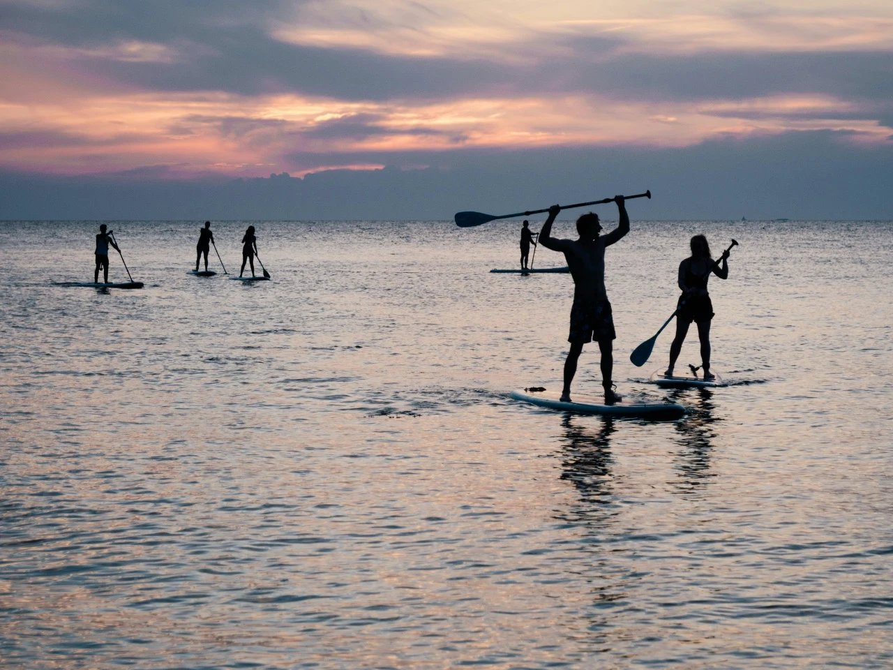 Rent paddleboards or kayaks at a local lake, river, or calm bay for a unique water perspective on the landscape.