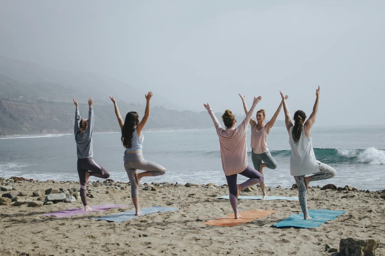 Find a park or beach offering an outdoor yoga, Pilates, or boot camp class you can do side by side.